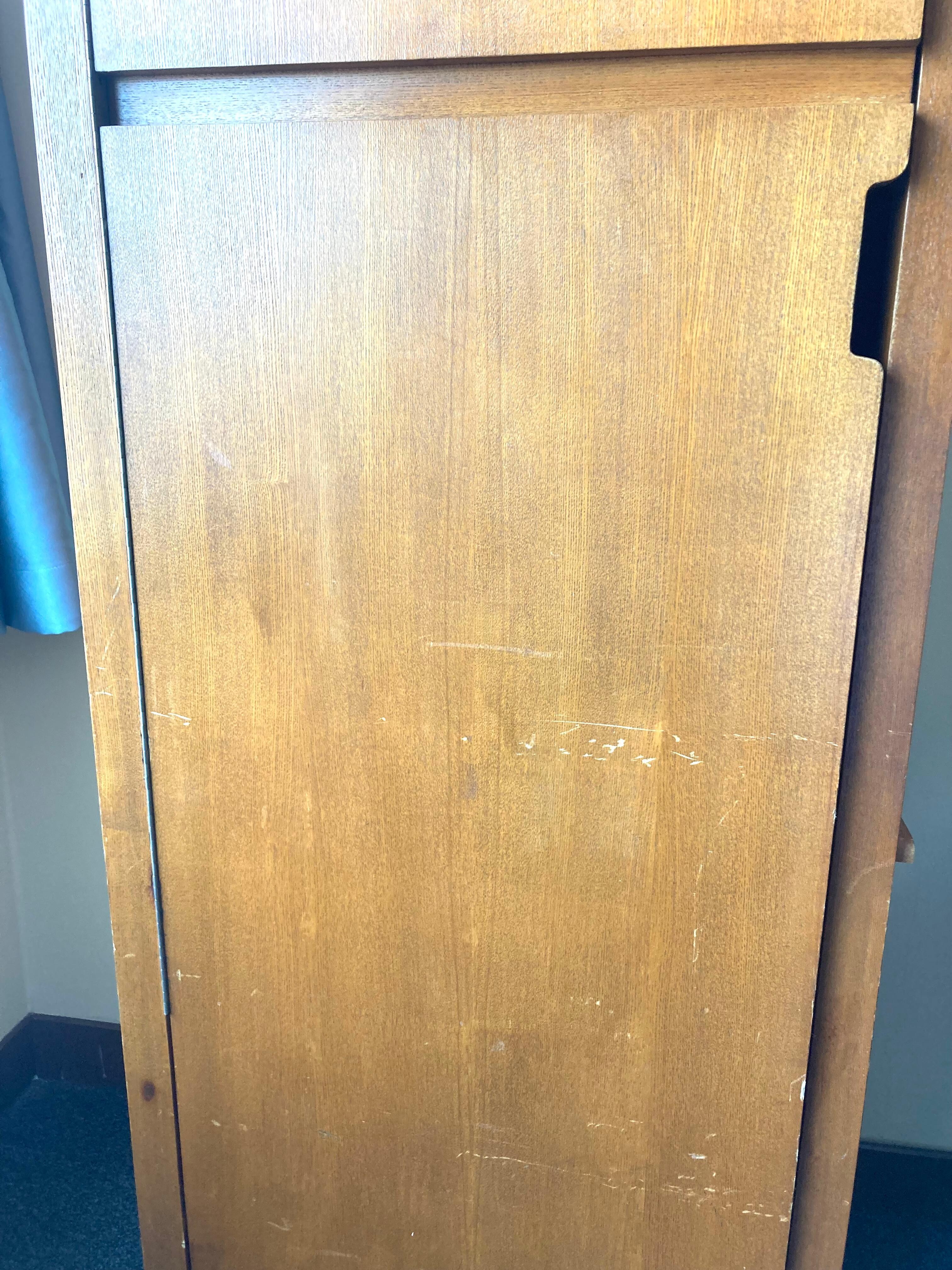 Cabinet closet containing non-functional safe and electric iron