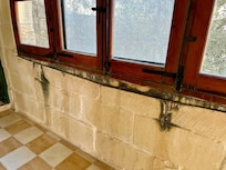 Damp walls outside bedrooms