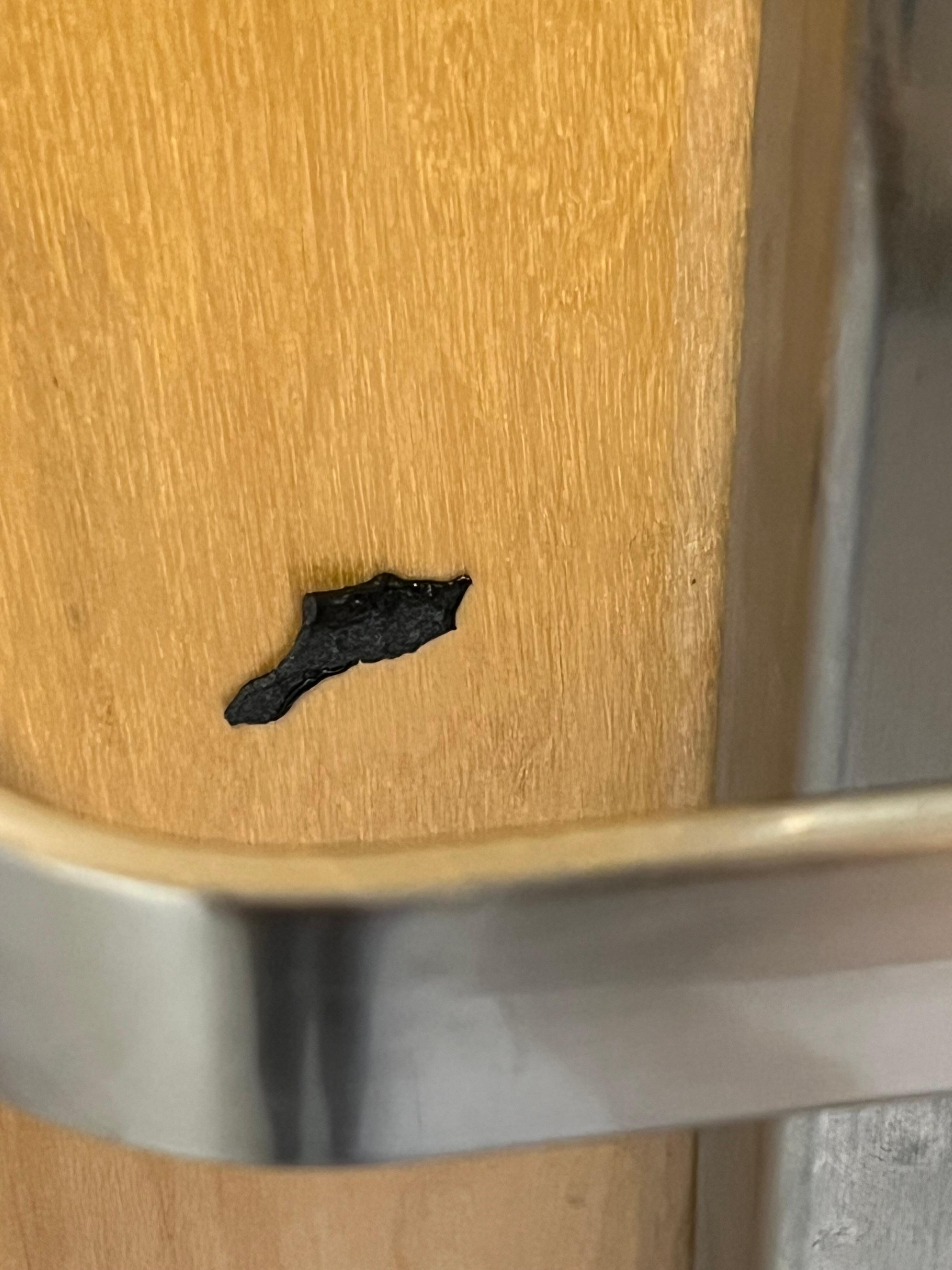 Black goo near door handle.