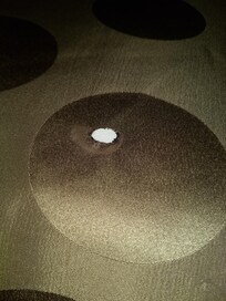 Cigarette burn on the comforter