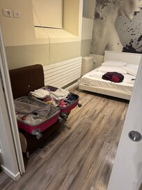 The bedroom when we arrived. Looks like the room had been cleaned and clearly someone else had checked in.