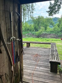 Shower and river view. There are reed screens on the other 2 open sides.