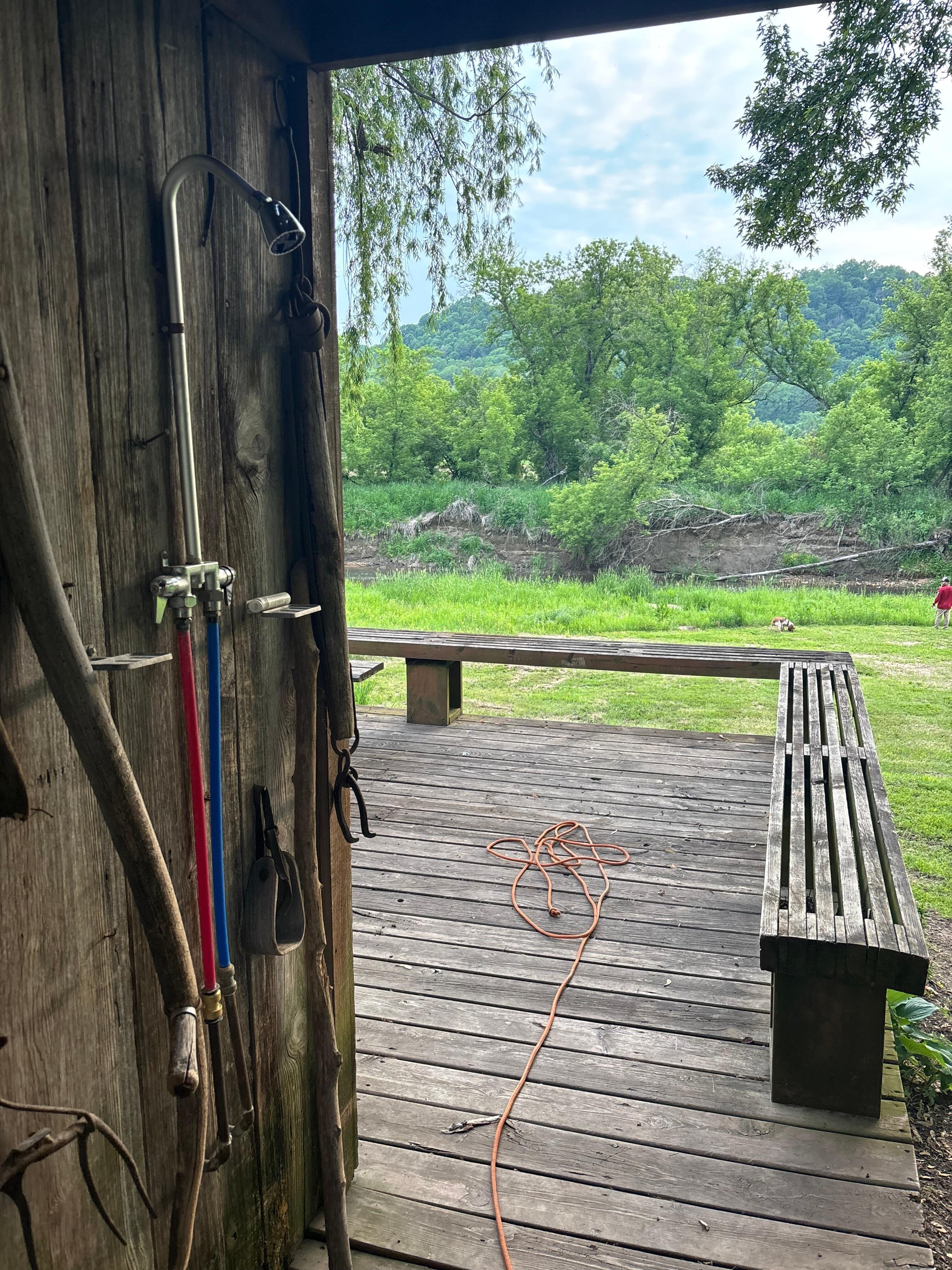 Shower and river view. There are reed screens on the other 2 open sides. 