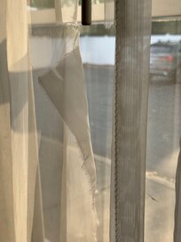 Curtains torn.