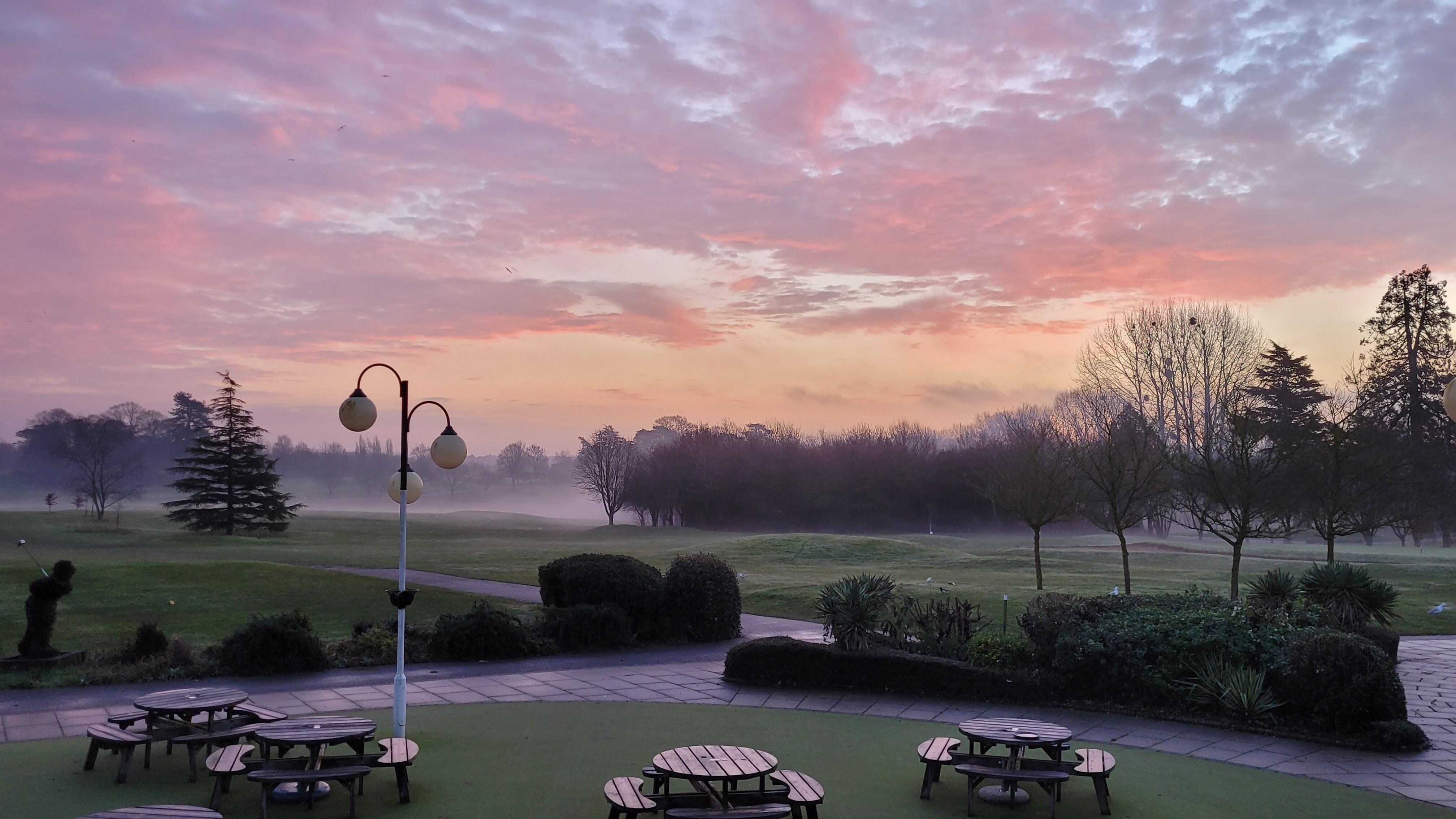 Winter morning view from outside lounge across golf course.