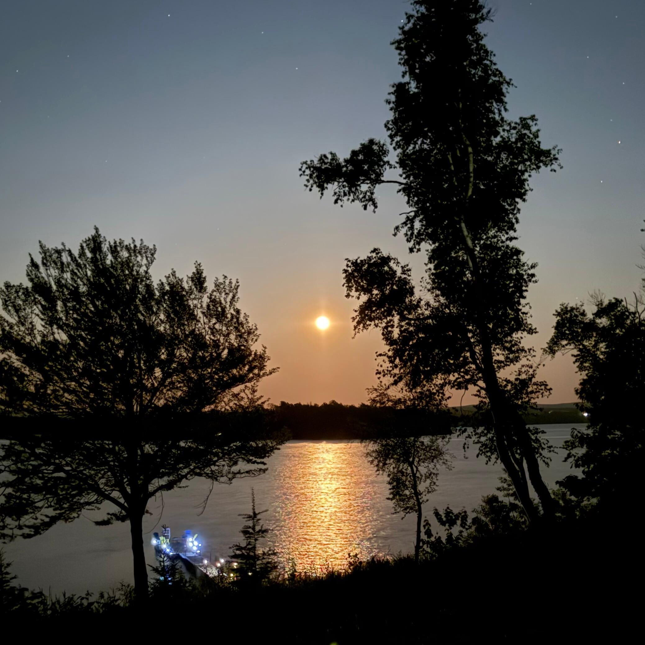 The “strawberry moon” and dock in the early evening. 