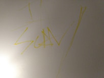 This graffiti was on the wall above a lamp (one of three such markings).