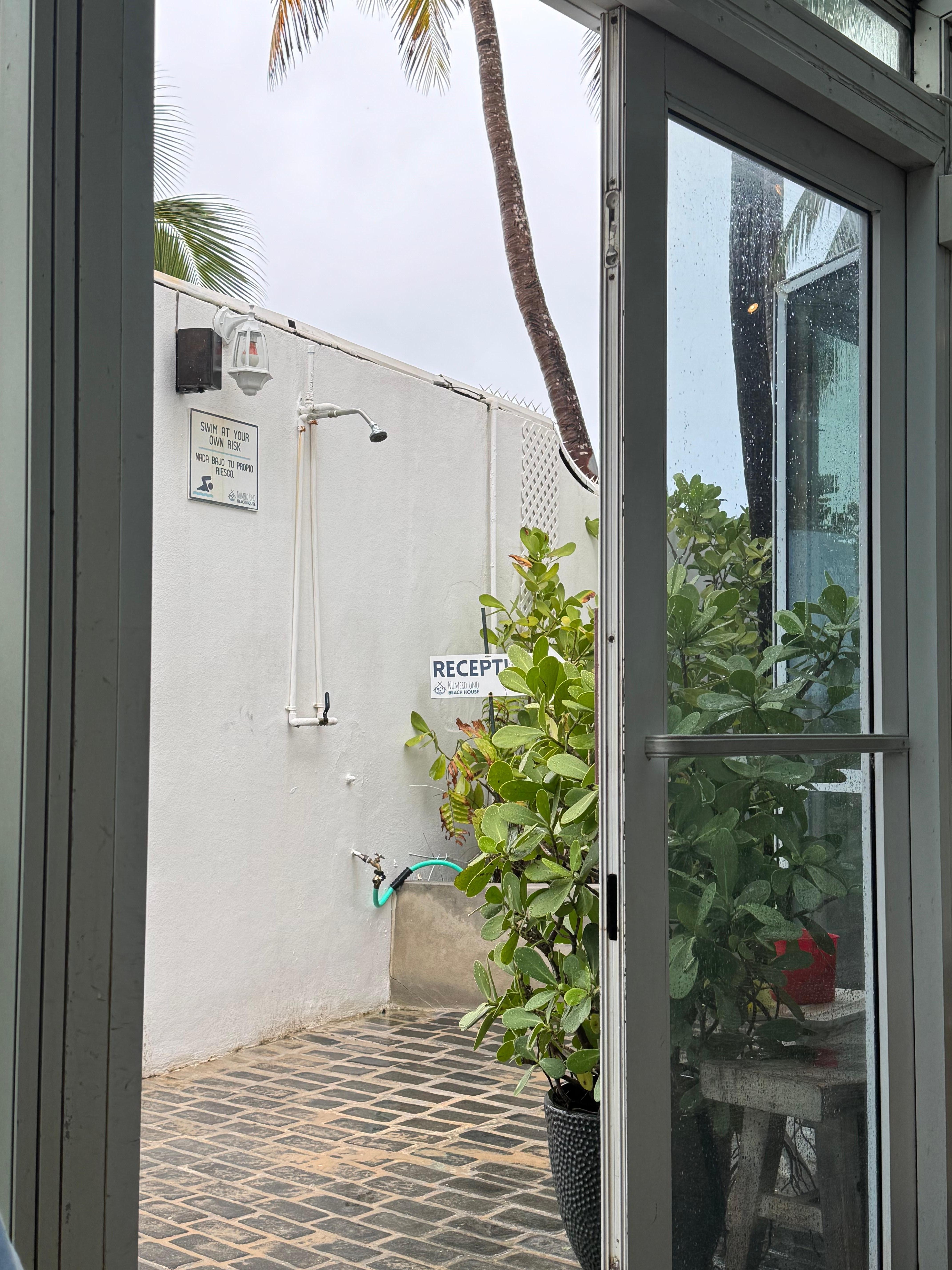 Outdoor beach foot and body shower area. 