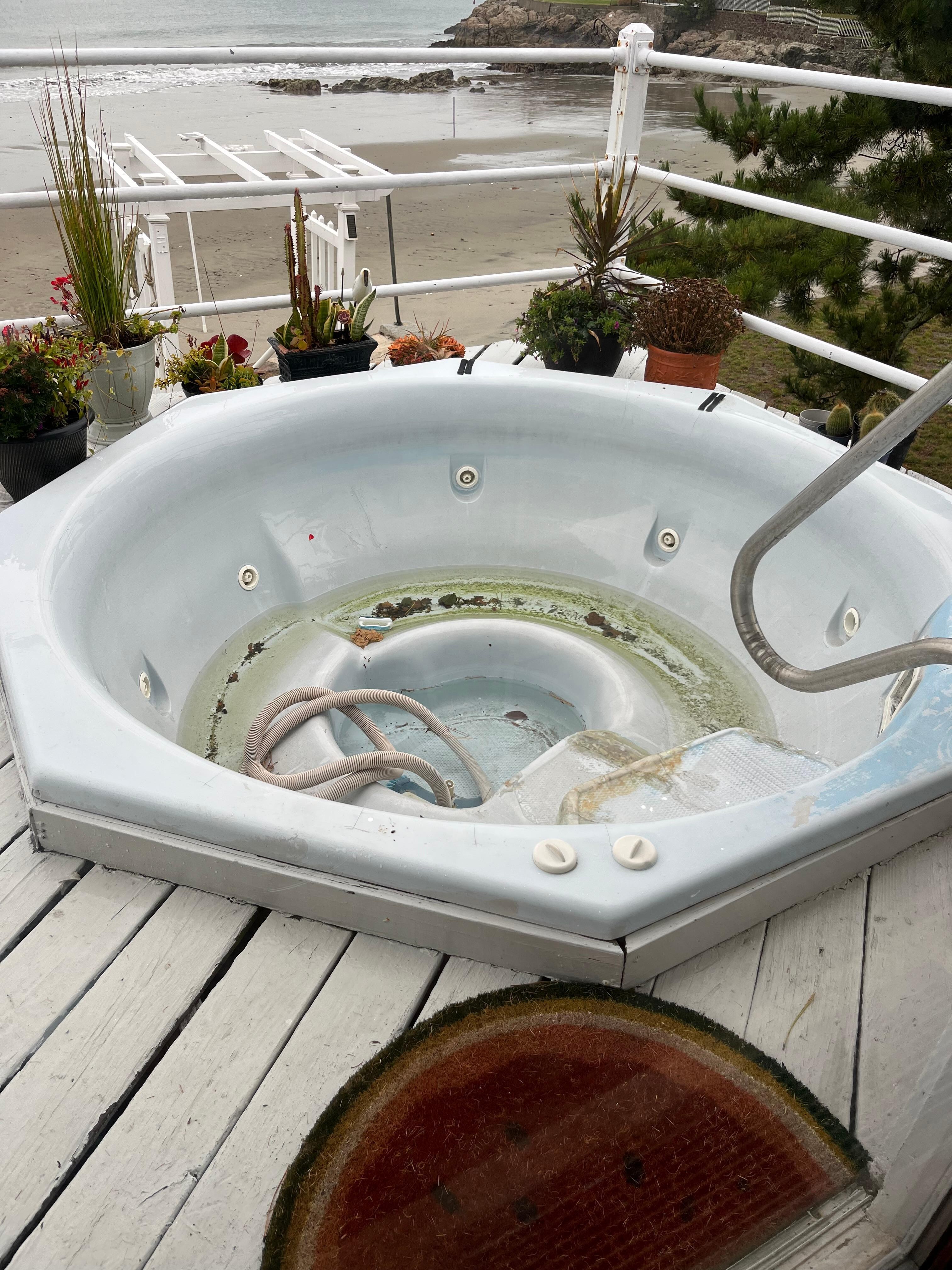 Hot tub is disgusting and a safety hazard for children. Fine if it’s closed for winter but then drain it properly and put a cover on it. 