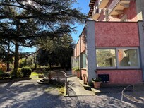 Front door of property taken from the side parking lot.