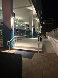 Outdoor patio/pool at night.