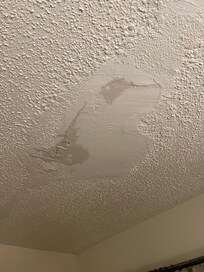 Leaky Ceiling plaster falling and water all over room during storm