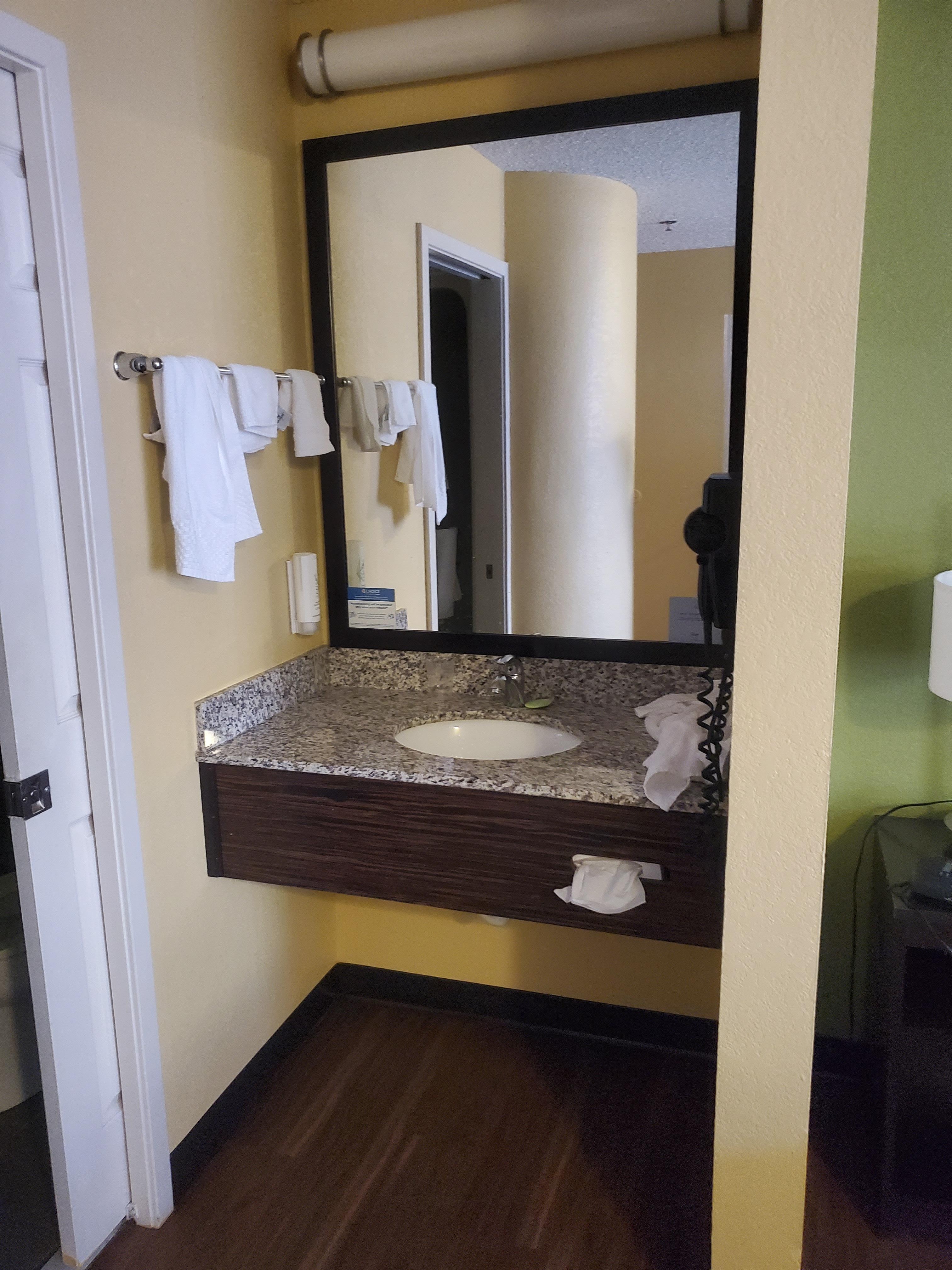 Sink outside of shower & toliet