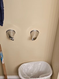 Broken. No toilet tissue holder.