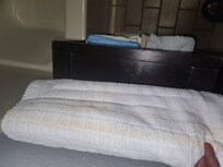 Dirty towels folded in bathroom