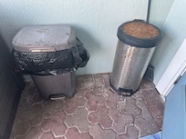 Rusted and filthy trash cans on main deck.