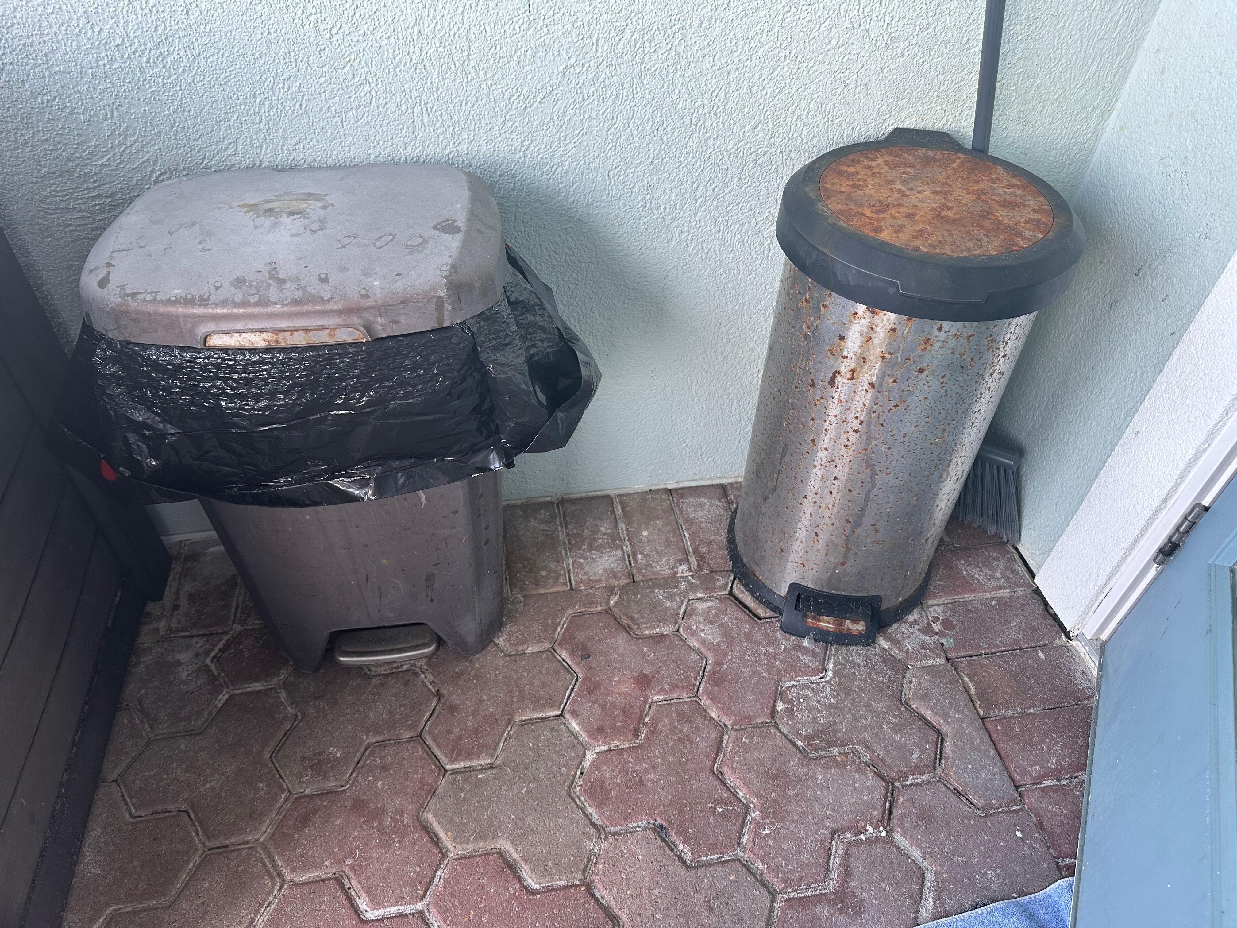 Rusted and filthy trash cans on main deck.