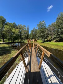 On pond boat overlooking pond and property.