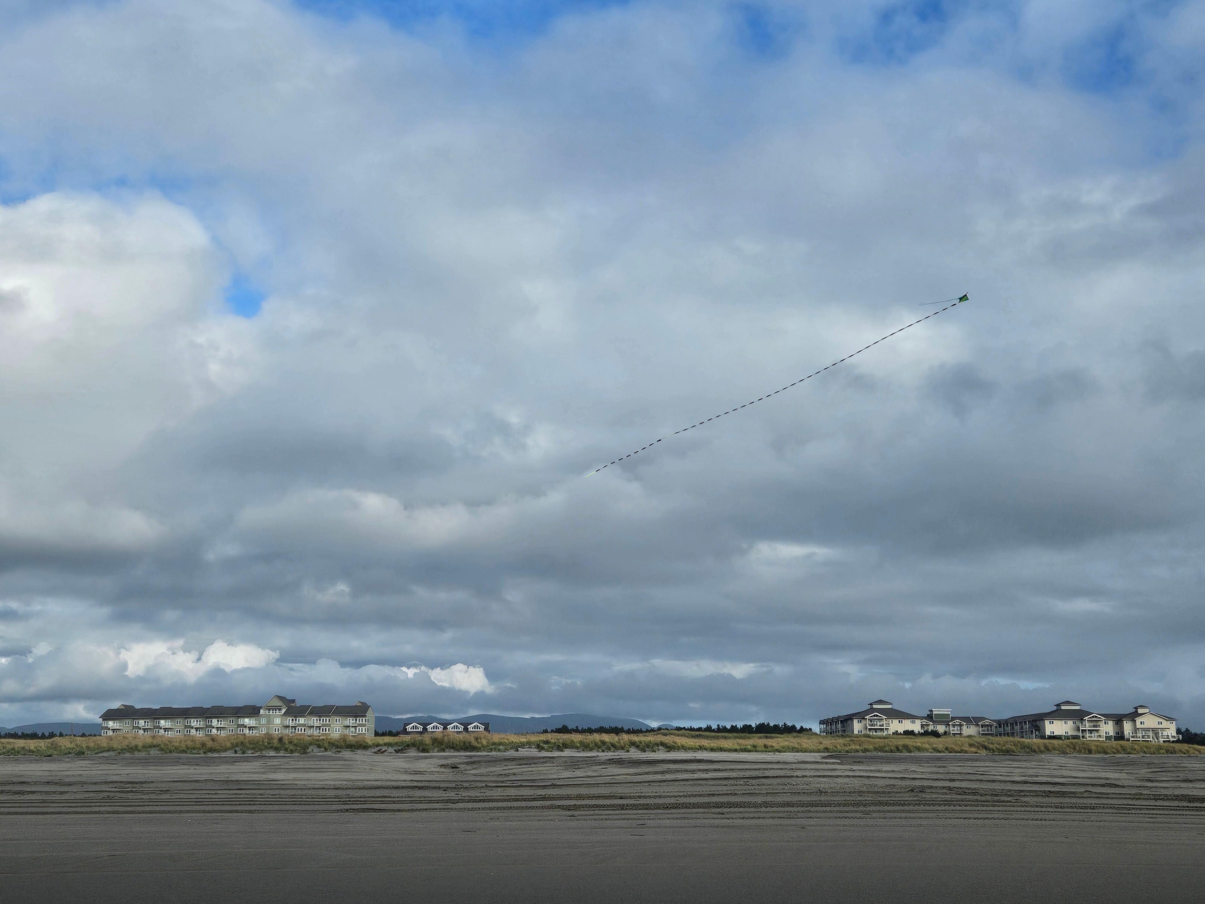 View from beach, condo is 1st floor, to the far left, of the building on the left.