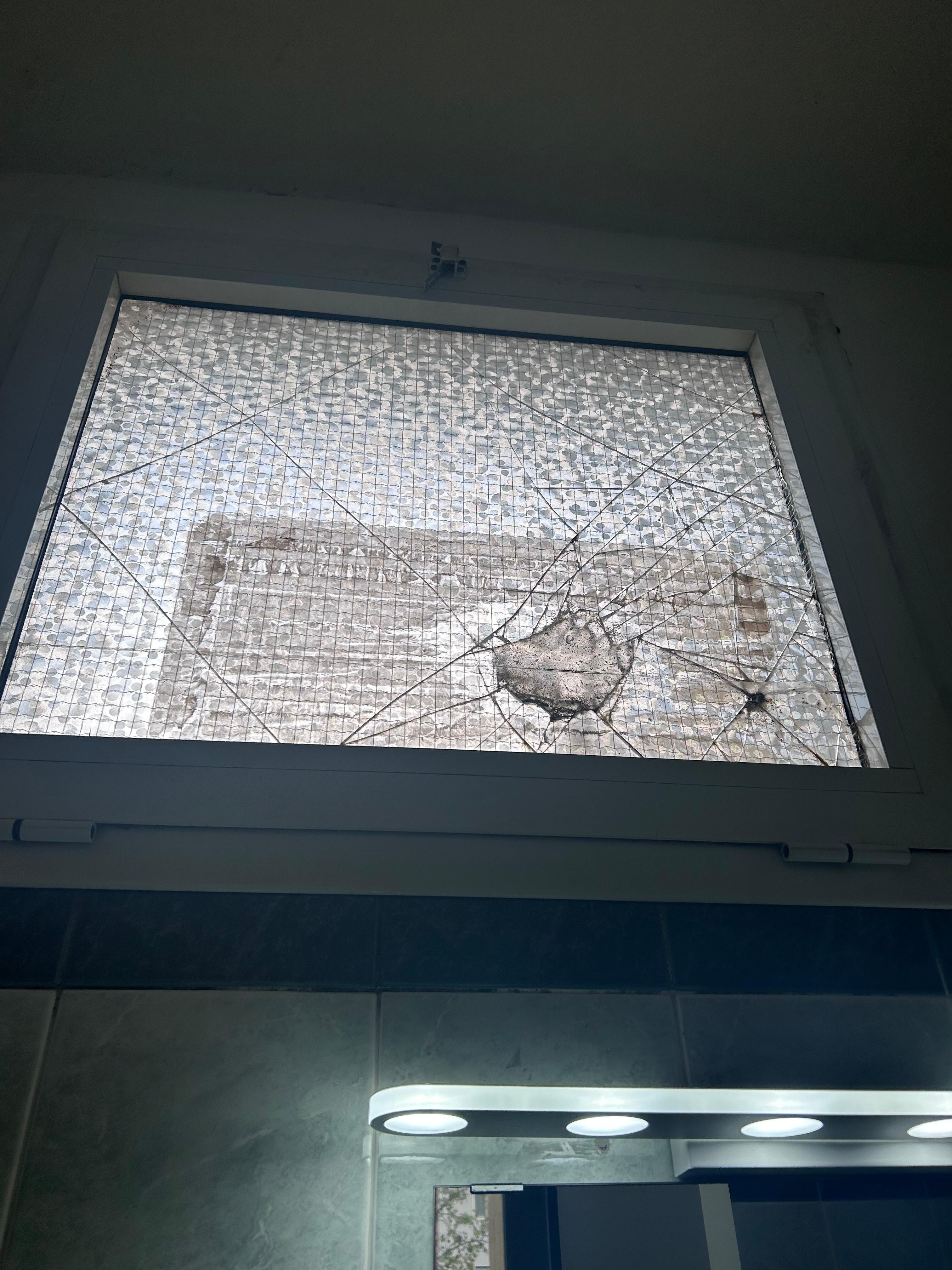 Broken window in bathroom 