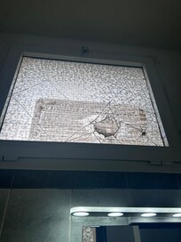 Broken window in bathroom