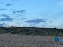 View of hotel tower rooms from beach/ocean shore line