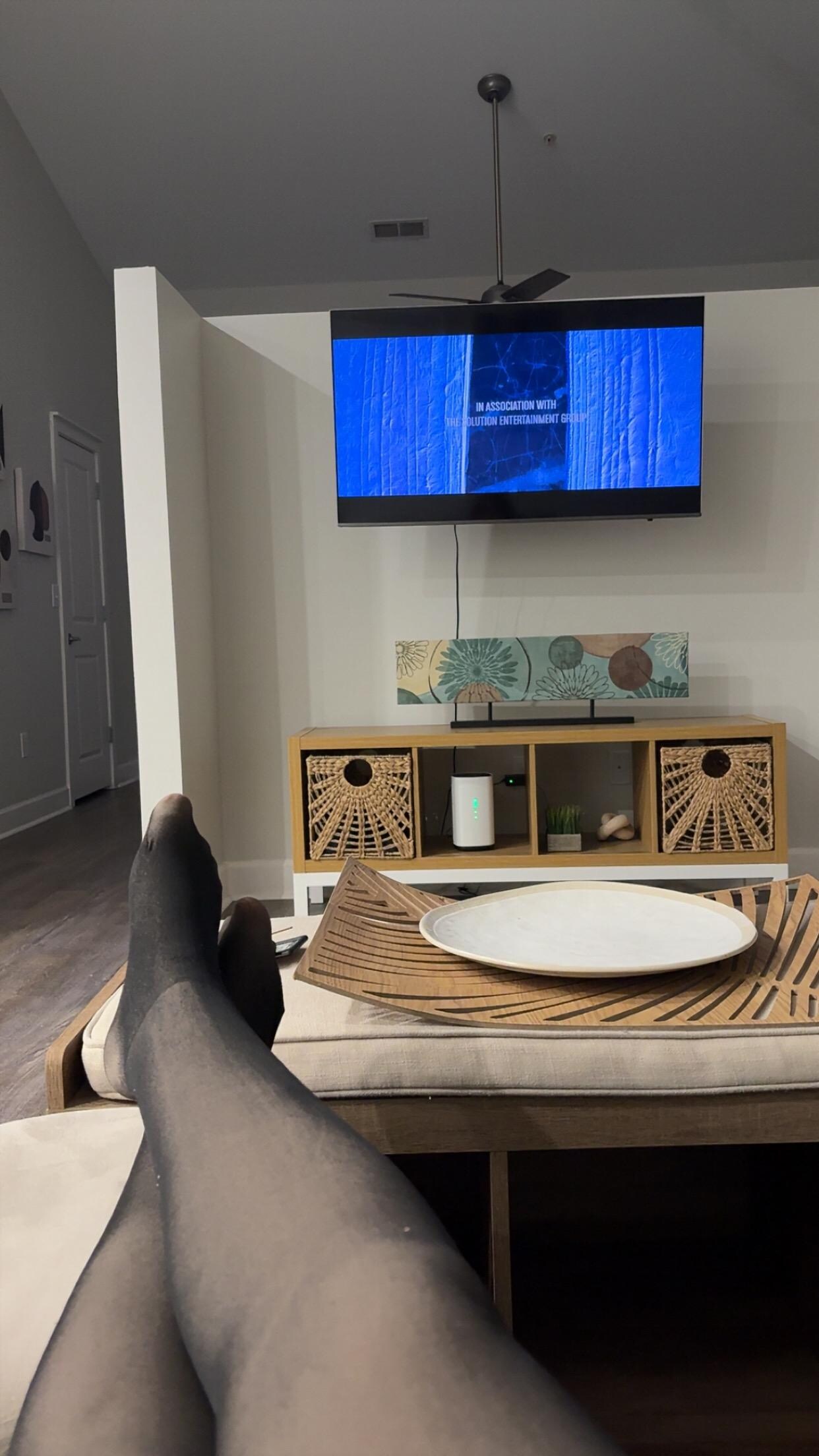 Comfortable couch & drinks being made in the kitchen next to me haha