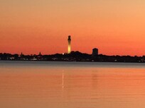 Sunset on beach with PTown in the distance.