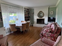 Front sitting room,
with additional formal sitting room and piano.