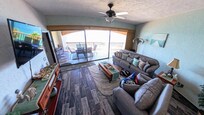 Living room, leading to balcony.