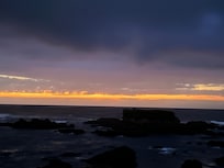 The sun setting on the ocean (5 minute walk from the hotel