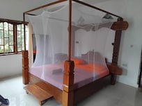 Lush comfy king-size bed with full mosquito protection