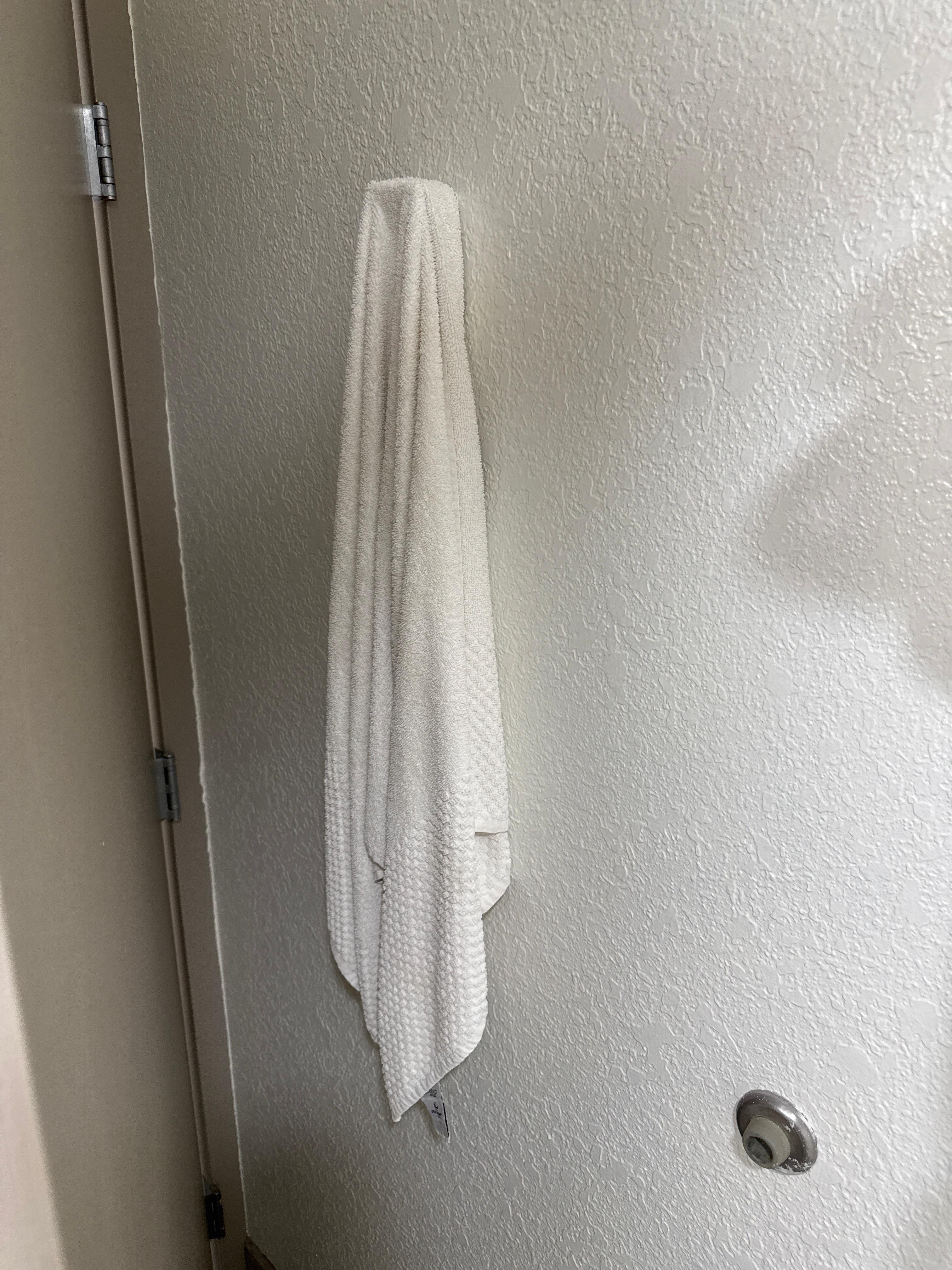 Dirty towel behind the door