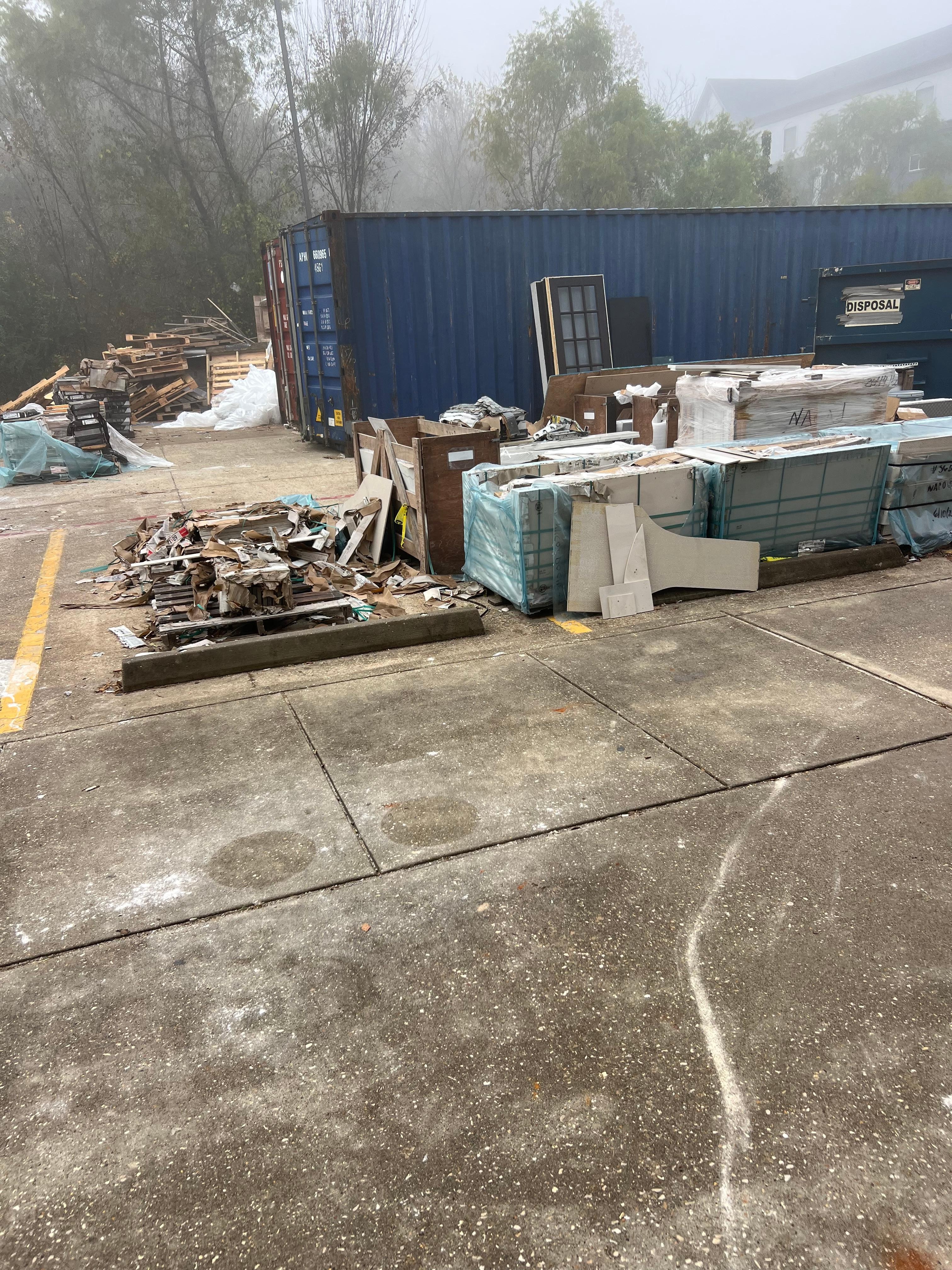 Dumpster by the side entrance that we had to use because the from t lobby was blocked off