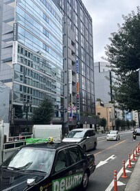 The hotel is the tall, black building