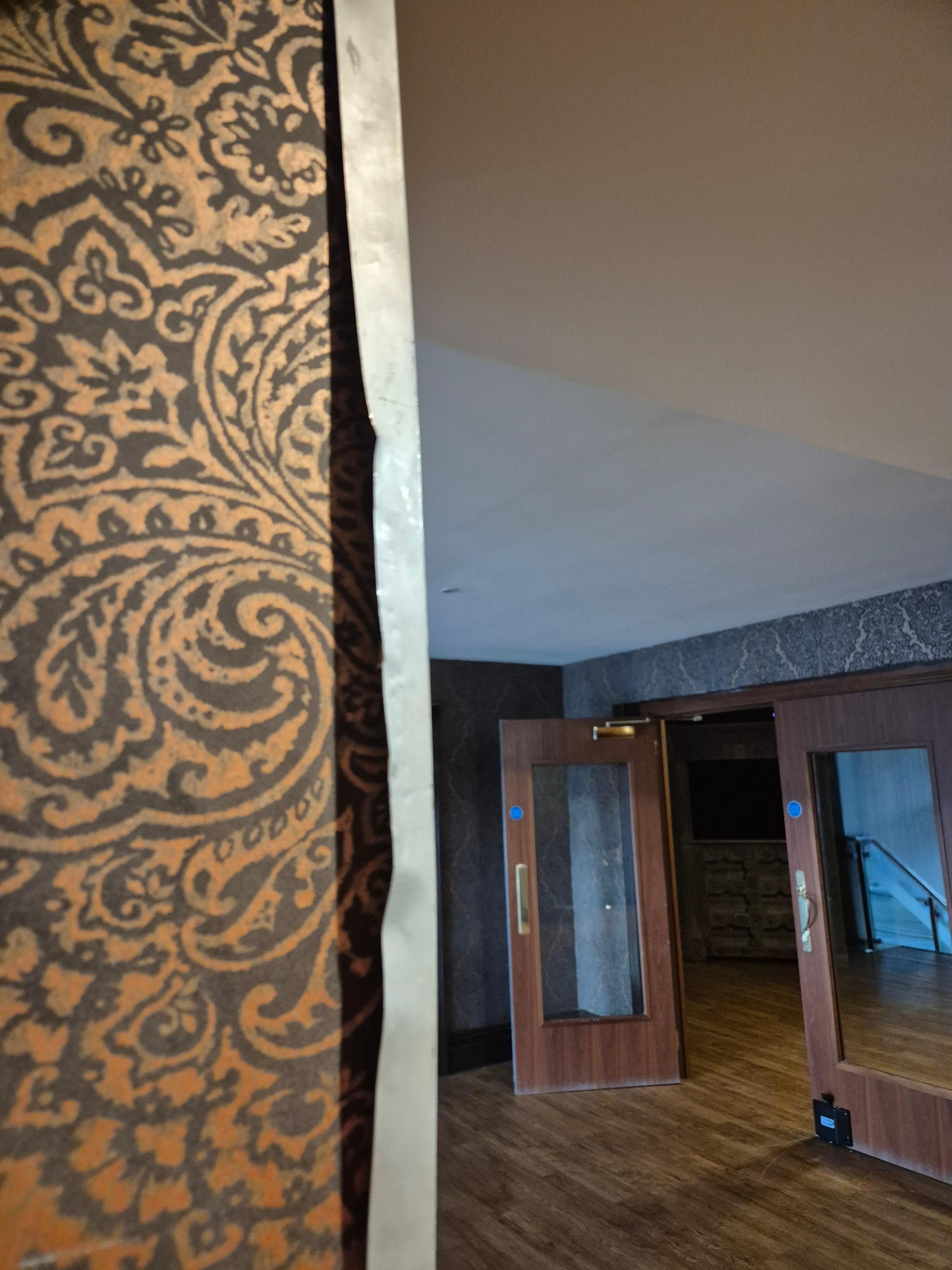 Metal framework coming away from the entrance to the lift