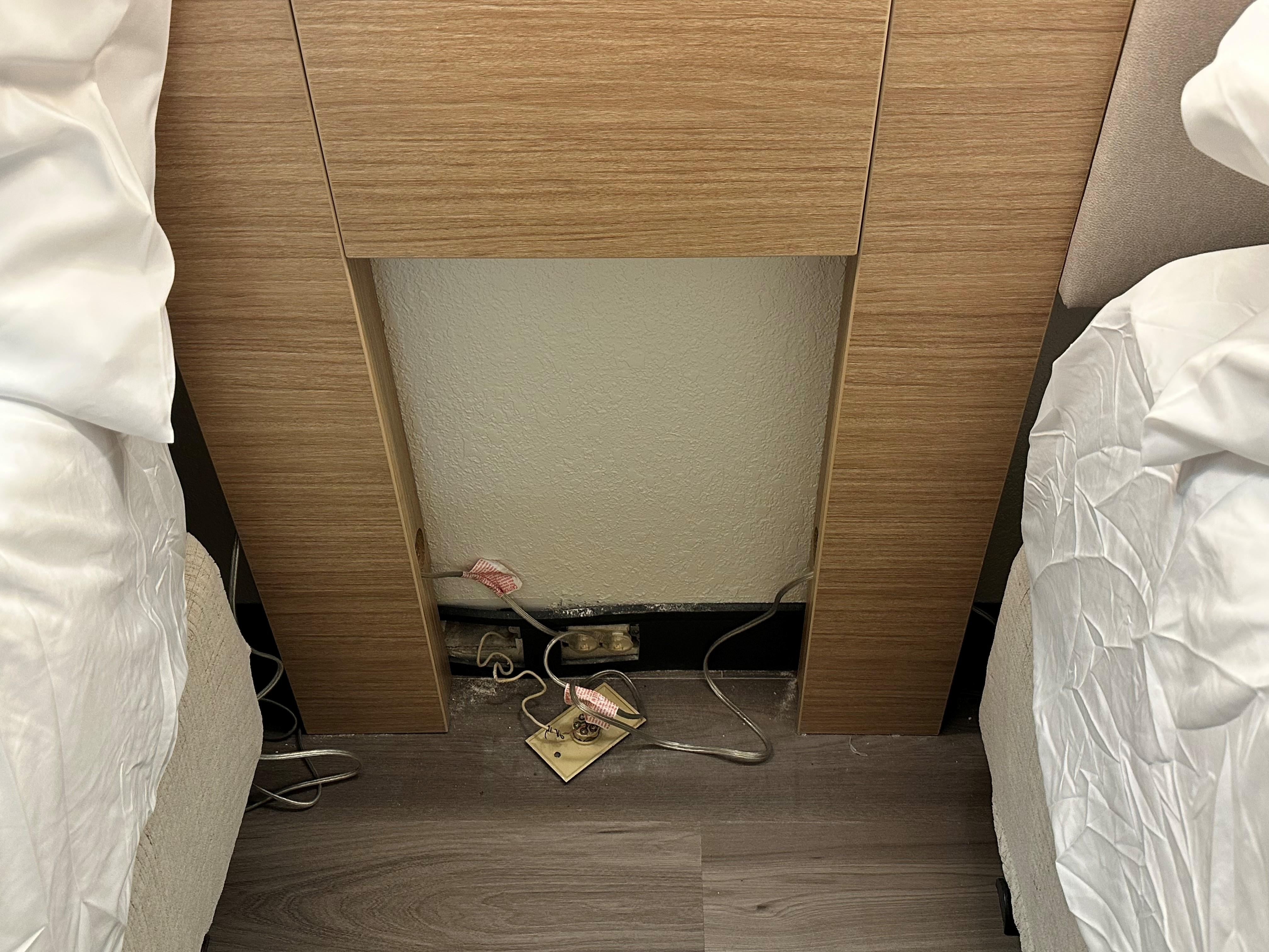 this was beind the bedside stand. we had to pull it out looking for an outlet
