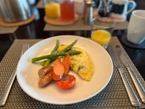 Spinach and cheese omelette with sausages
