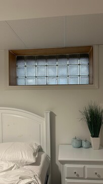 Block window with no ability to open. Only window from the downstairs bedroom.