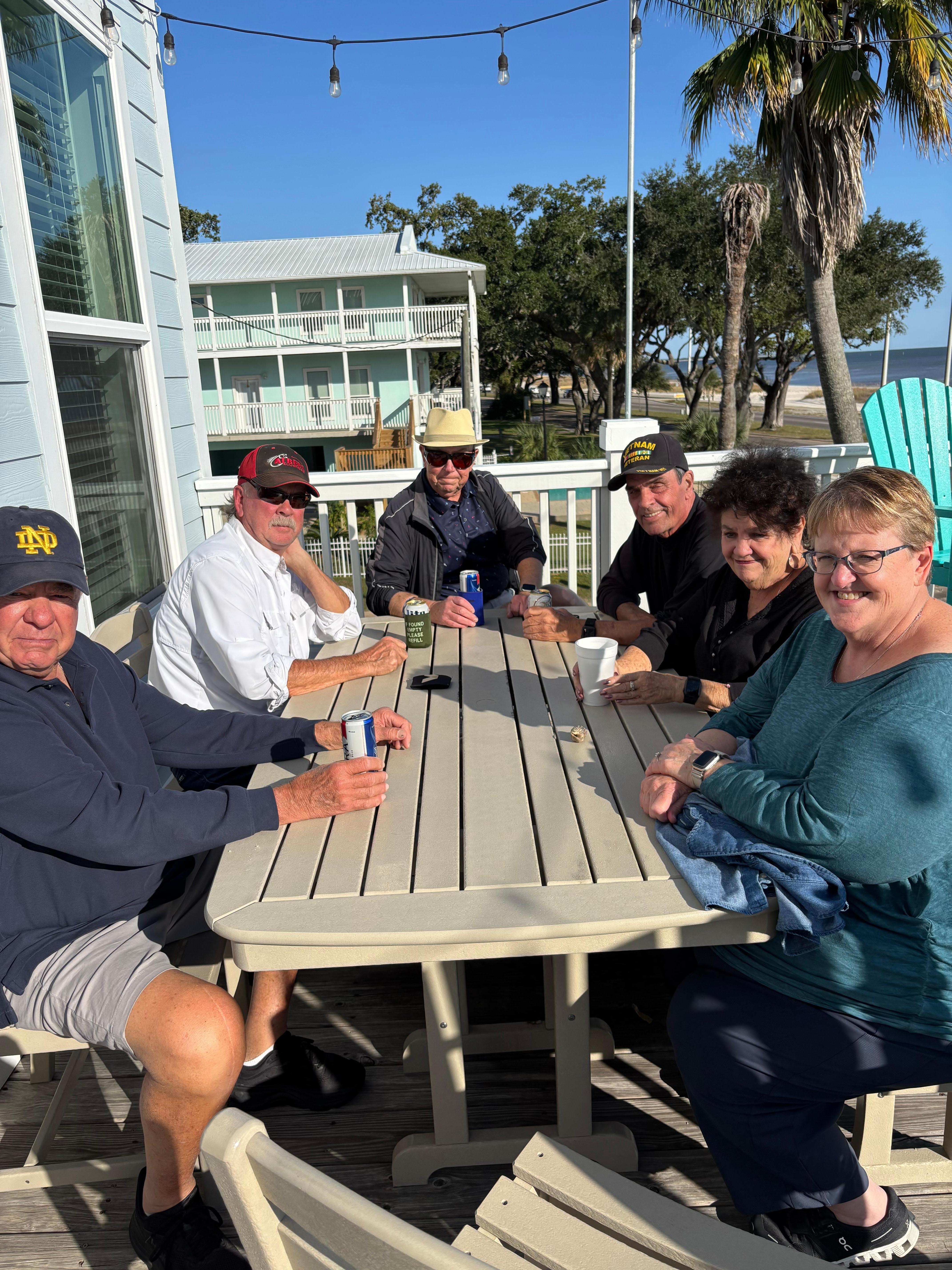 Our group around the large table on the front deck overlooking the ocean