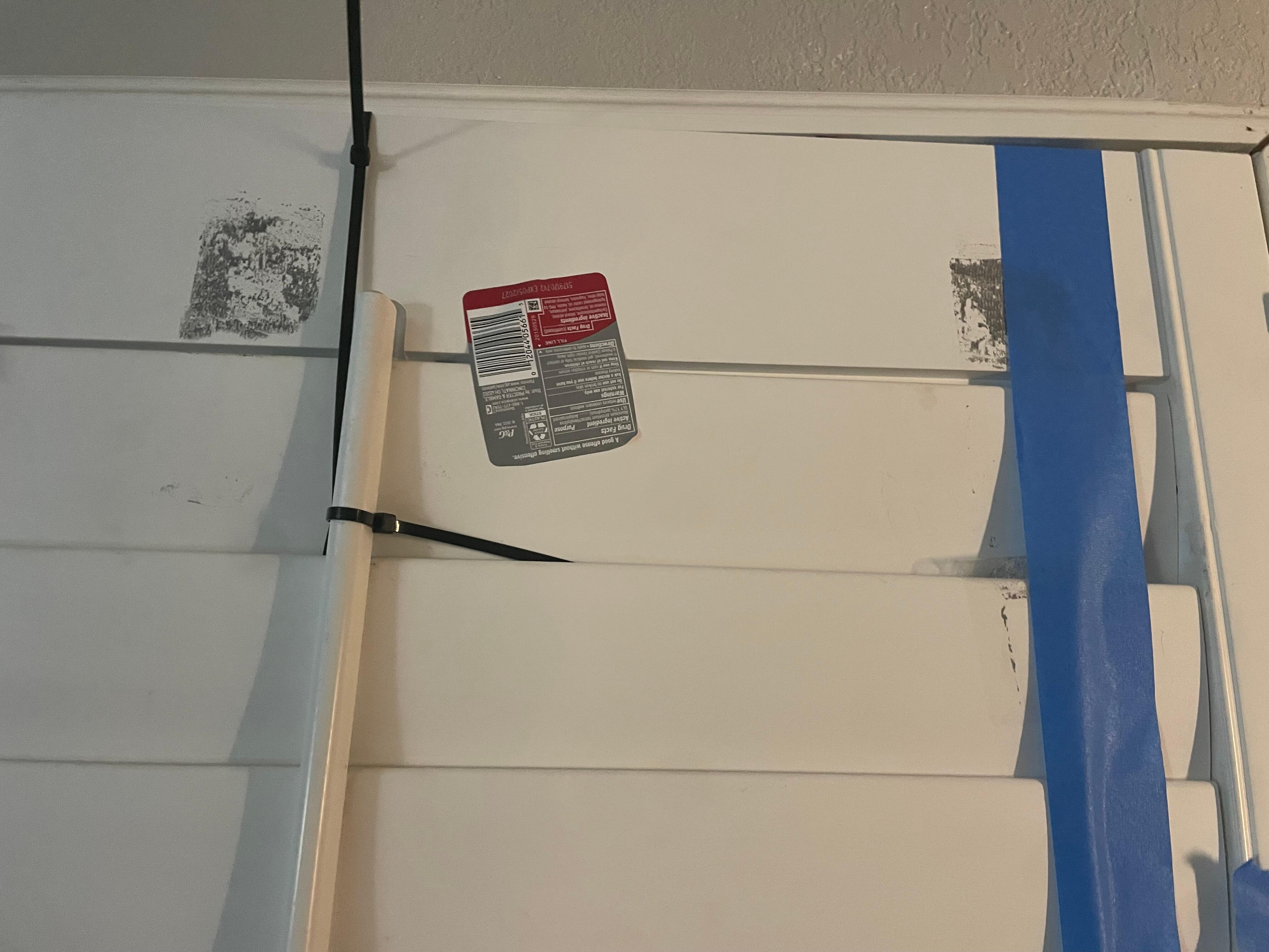 Held together with tape, a zip tie, and a drug bottle label. Gross. 