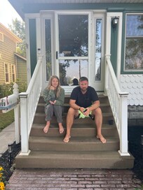 My daughter and son in law enjoying morning coffee on front stoop
