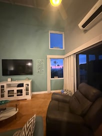 Sunset through the window as seen from the kitchen looked like a painting! I went outside and paused our meal. We Loved the chairs on the porch and the table for eating!