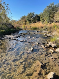 The Pedernales River down the trails.