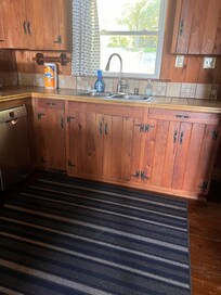 Traditional knotty pine cabinetry brought back warm memories of my child at my family’s summer cottage!