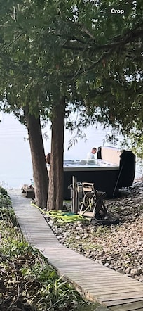 Man by hot tub with my daughter in it.