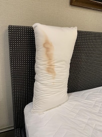 Unknown substance on pillow during checkout (you have to remove your own sheets)