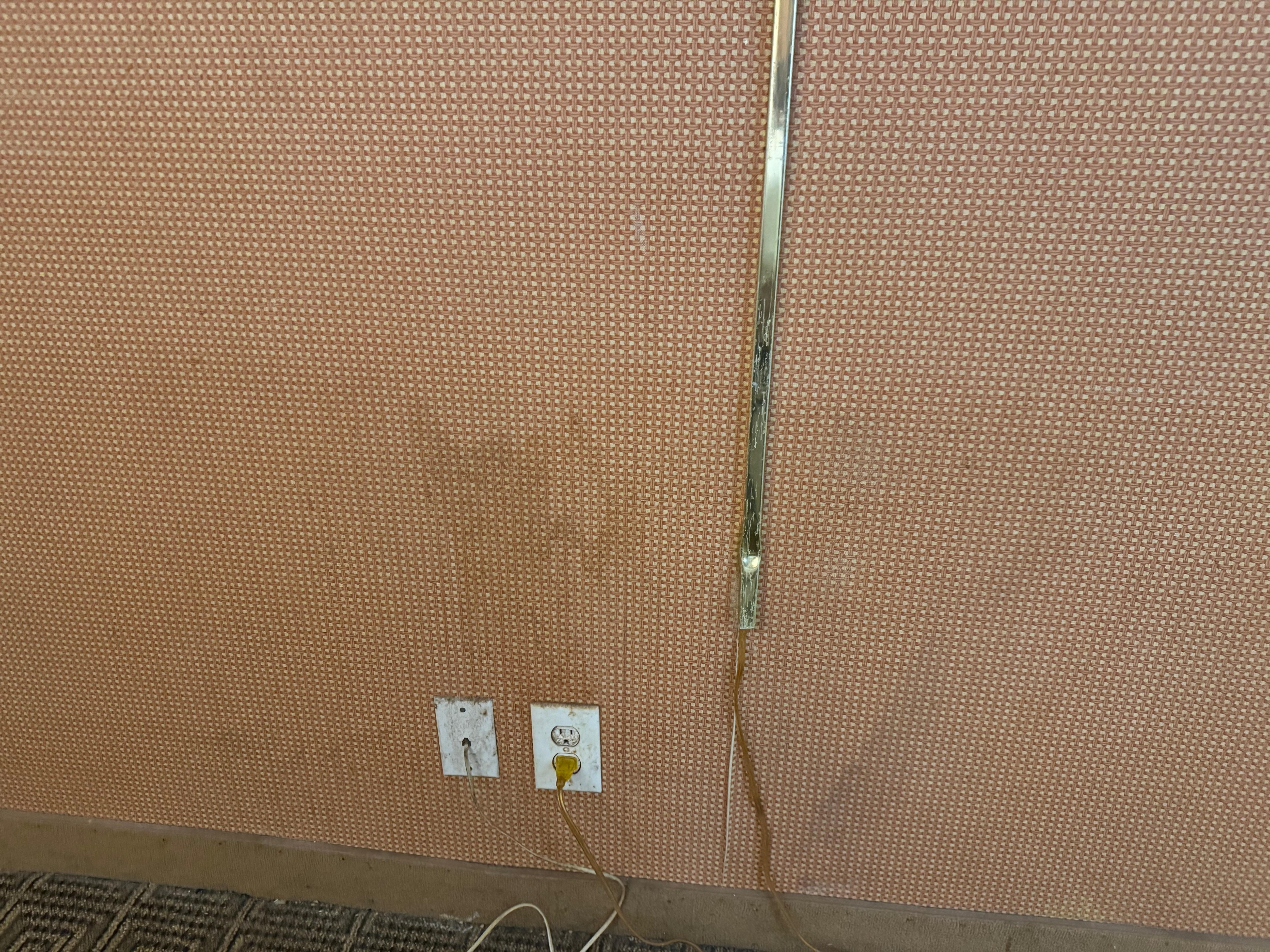 Large stains all over the walls, doors, and dirt/mold on the sconces 