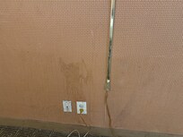 Large stains all over the walls, doors, and dirt/mold on the sconces