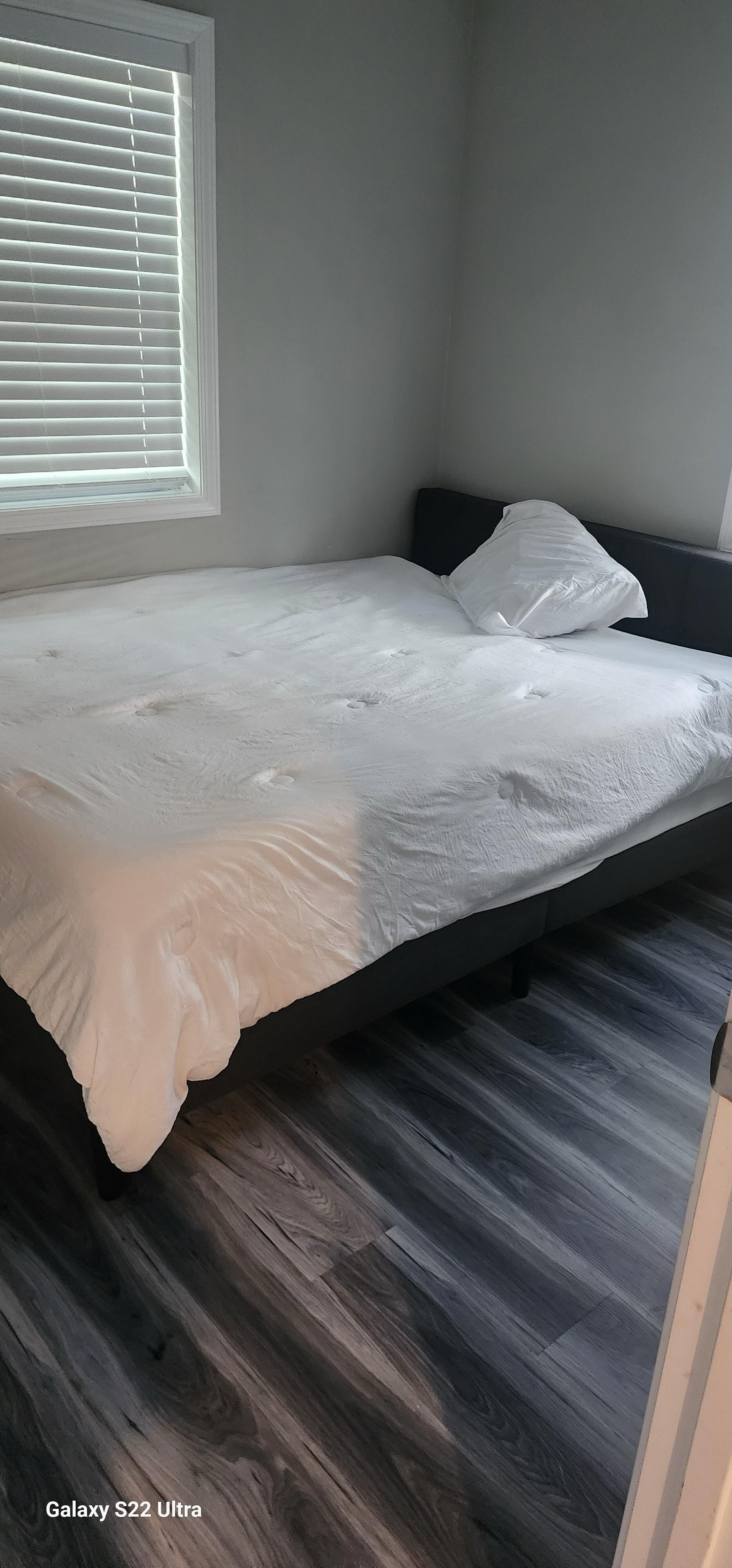 One pillow just tossed on the master bed.
